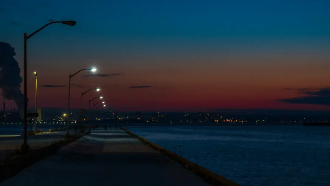 Street lights along the lake by the Burlington Lift Bridge at night